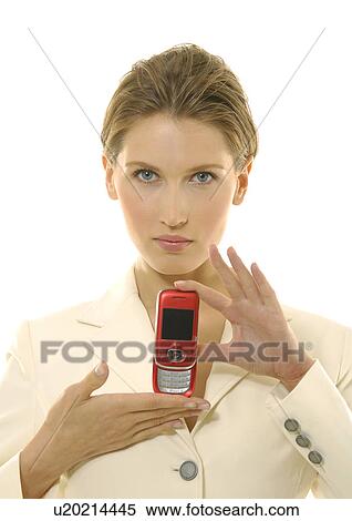 Portrait of a businesswoman showing a mobile phone View Large Photo Image Stock Photography - Portrait of a businesswoman showing a mobile phone. Fotosearch