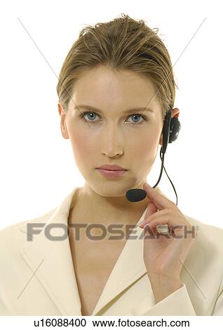 Portrait of a businesswoman wearing a headset View Large Photo Image Stock Image - Portrait of a businesswoman wearing a headset. Fotosearch