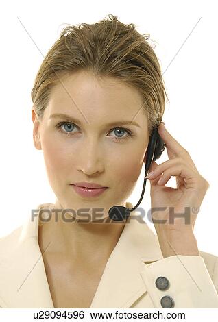 Portrait of a businesswoman wearing a headset View Large Photo Image Stock Photograph - Portrait of a businesswoman wearing a headset. Fotosearch