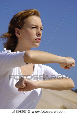 Close-up of a young woman practicing yoga View Large Photo Image Stock Image - Close-up of a young woman practicing yoga. Fotosearch
