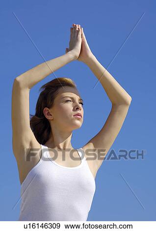 Young woman practicing yoga View Large Photo Image Stock Photo - Young woman practicing yoga. Fotosearch