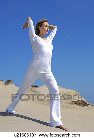 Young woman practicing yoga View Large Photo Image Stock Photo - Young woman practicing yoga. Fotosearch