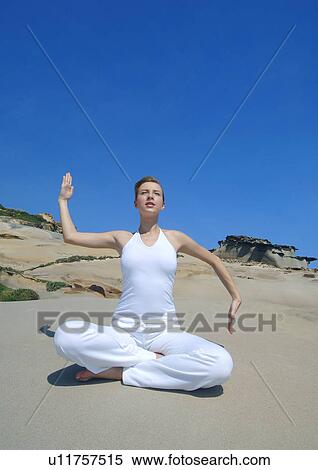 Young woman practicing yoga View Large Photo Image Stock Photography - Young woman practicing yoga. Fotosearch
