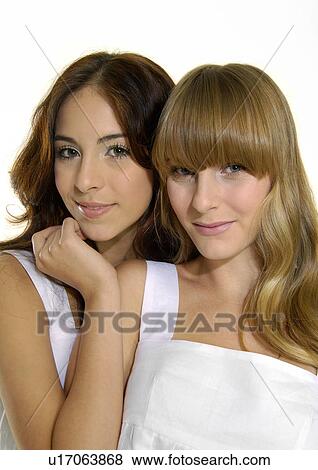 Portrait of two young women smiling View Large Photo Image Stock Photo - Portrait of two young women smiling. Fotosearch