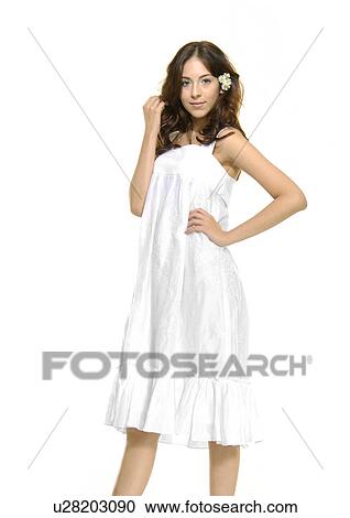 Portrait of a young woman with her hand on her hip View Large Photo Image Stock Image - Portrait of a young woman with her hand on her hip. Fotosearch