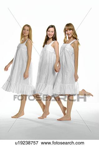 Portrait of three young women standing together View Large Photo Image Stock Photo - Portrait of three young women standing together. Fotosearch