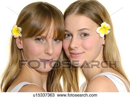 Stock Image - Portrait of two young women smiling. Fotosearch