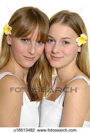 Portrait of two young women smiling View Large Photo Image Stock Image - Portrait of two young women smiling. Fotosearch