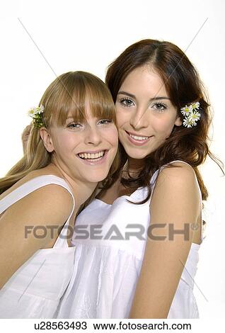 Stock Image - Portrait of two young women smiling. Fotosearch