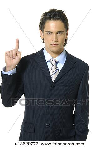 Portrait of a businessman gesturing and looking serious View Large Photo Image Stock Image - Portrait of a businessman gesturing and looking serious. Fotosearch