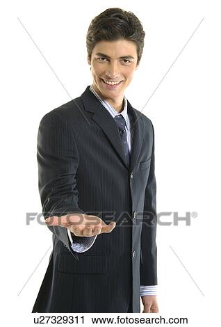 Portrait of a businessman gesturing and smiling View Large Photo Image Stock Image - Portrait of a businessman gesturing and smiling. Fotosearch