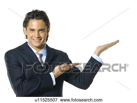Portrait of a businessman gesturing and smiling View Large Photo Image Stock Photo - Portrait of a businessman gesturing and smiling. Fotosearch