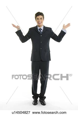Portrait of a businessman gesturing and smiling View Large Photo Image Stock Photo - Portrait of a businessman gesturing and smiling. Fotosearch