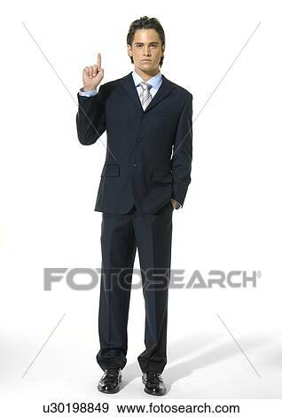 Portrait of a businessman gesturing and looking serious View Large Photo Image Stock Photo - Portrait of a businessman gesturing and looking serious. Fotosearch