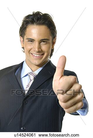 Portrait of a businessman making a thumbs up sign and smiling View Large Photo Image Stock Image - Portrait of a businessman making a thumbs up sign and smiling. Fotosearch