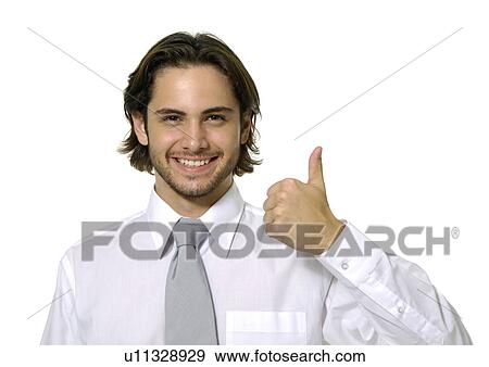 Portrait of a businessman making a thumbs up sign and smiling View Large Photo Image Stock Photo - Portrait of a businessman making a thumbs up sign and smiling. Fotosearch