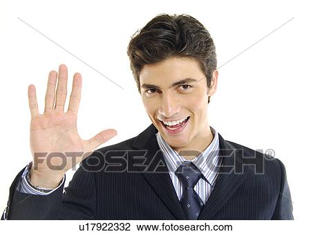 Portrait of a businessman making a stop gesture and smiling View Large Photo Image Stock Image - Portrait of a businessman making a stop gesture and smiling. Fotosearch
