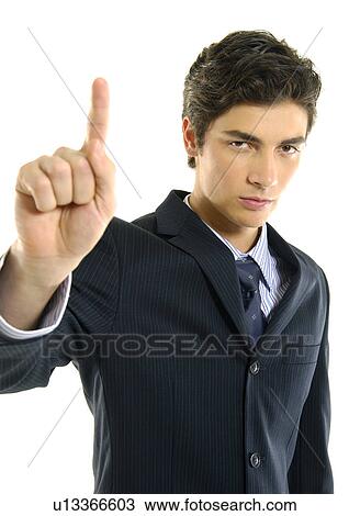 Stock Image - Portrait of a businessman pointing and looking serious. Fotosearch