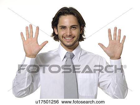 Portrait of a businessman showing his palms and smiling View Large Photo Image Stock Photograph - Portrait of a businessman showing his palms and smiling. Fotosearch