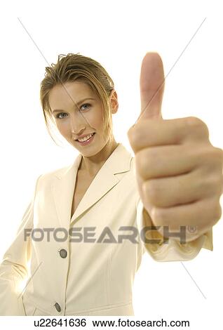Portrait of a businesswoman making a thumbs up sign View Large Photo Image Stock Photograph - Portrait of a businesswoman making a thumbs up sign. Fotosearch