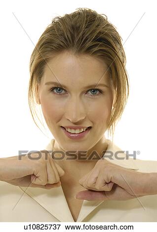 Portrait of a businesswoman making fist and smiling View Large Photo Image Stock Photo - Portrait of a businesswoman making fist and smiling. Fotosearch