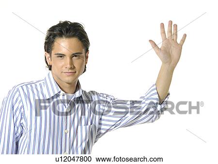 Portrait of a young man gesturing View Large Photo Image Stock Image - Portrait of a young man gesturing. Fotosearch