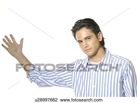 Portrait of a young man gesturing View Large Photo Image Stock Image - Portrait of a young man gesturing. Fotosearch