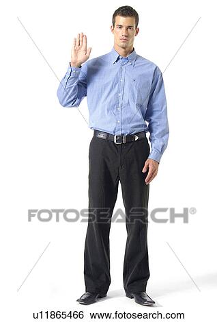 Stock Photograph - Portrait of a young man gesturing. Fotosearch