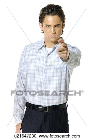 Portrait of a young man pointing View Large Photo Image Stock Image - Portrait of a young man pointing. Fotosearch