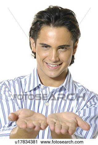 Portrait of a young man showing his palms and smiling View Large Photo Image Stock Image - Portrait of a young man showing his palms and smiling. Fotosearch