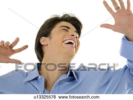 Close-up of a young man laughing View Large Photo Image Stock Photo - Close-up of a young man laughing. Fotosearch