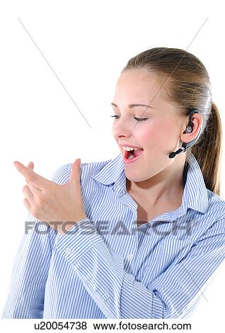 Stock Photo - Close-up of a young woman listening to music and gesturing. Fotosearch