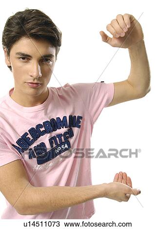 Stock Image - Portrait of a young man gesturing. Fotosearch