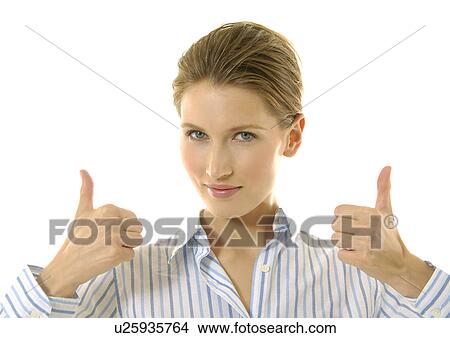 Portrait of a young woman making a thumbs up sign View Large Photo Image Picture - Portrait of a young woman making a thumbs up sign. Fotosearch