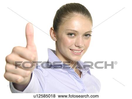 Portrait of a young woman making a thumbs up sign View Large Photo Image Stock Photo - Portrait of a young woman making a thumbs up sign. Fotosearch