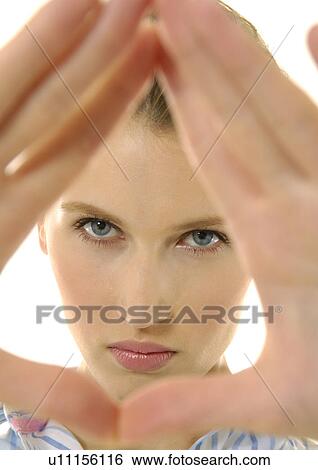 Stock Photograph - Portrait of a young woman posing. Fotosearch