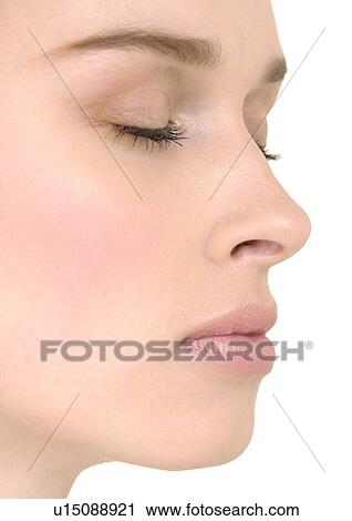 Close-up of a young woman with her eyes closed View Large Photo Image Stock Image - Close-up of a young woman with her eyes closed. Fotosearch