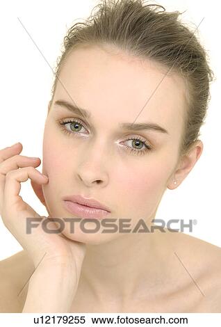 Portrait of a young woman with her hand on her chin View Large Photo Image Stock Photography - Portrait of a young woman with her hand on her chin. Fotosearch