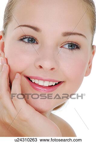 Stock Image - Close-up of a young woman smiling. Fotosearch