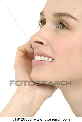 Stock Photo - Close-up of a young woman smiling. Fotosearch