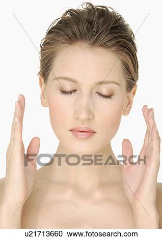 Close-up of a young woman with her eyes closed View Large Photo Image Stock Image - Close-up of a young woman with her eyes closed. Fotosearch
