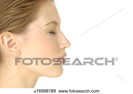 Close-up of a young woman with her eyes closed View Large Photo Image Stock Photo - Close-up of a young woman with her eyes closed. Fotosearch