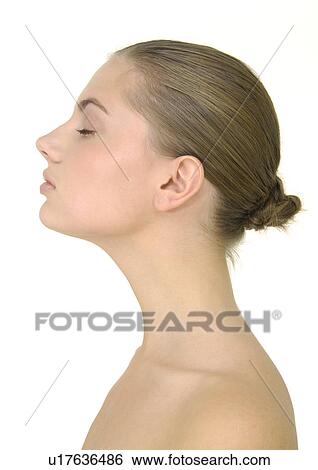 Close-up of a young woman with her eyes closed View Large Photo Image Stock Photograph - Close-up of a young woman with her eyes closed. Fotosearch