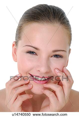 Stock Image - Portrait of a young woman smiling. Fotosearch