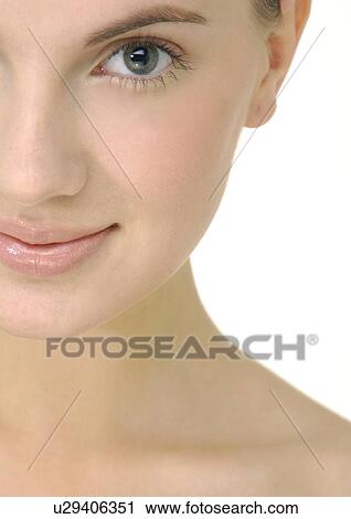 Stock Image - Portrait of a young woman smiling. Fotosearch