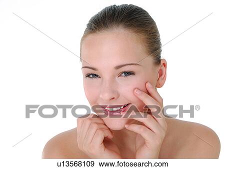 Stock Photo - Portrait of a young woman smiling. Fotosearch