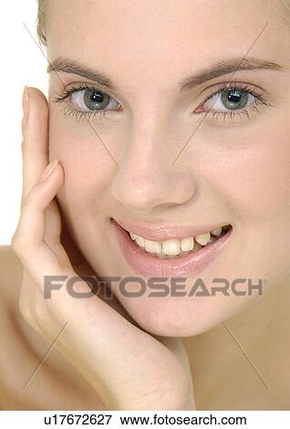 Stock Photo - Portrait of a young woman smiling. Fotosearch