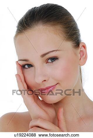 Stock Photo - Portrait of a young woman smiling. Fotosearch