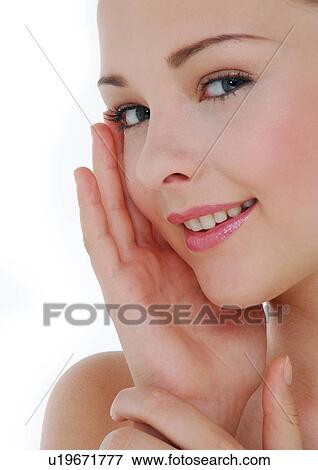 Stock Photo - Portrait of a young woman smiling. Fotosearch