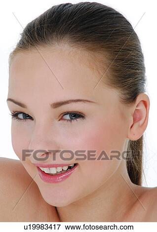 Stock Photo - Portrait of a young woman smiling. Fotosearch